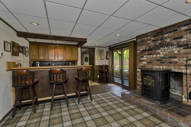 198 Mountain View Dr, Holyoke, MA 01040 - indoor dry bar with a wood stove, dark carpet, and a drop ceiling