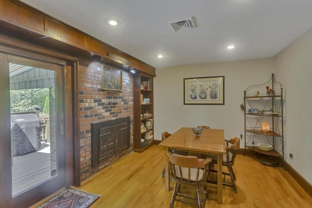 198 Mountain View Dr, Holyoke, MA 01040 - dining room featuring light wood-style flooring, a fireplace, baseboards, and recessed lighting