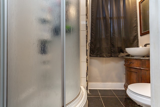 bathroom featuring vanity, toilet, tile patterned floors, and walk in shower