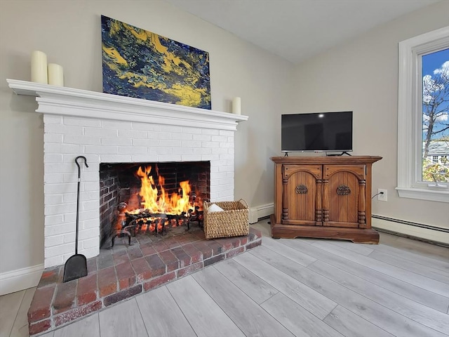 11 Great Oak Rd, Brewster, MA 02631 - interior space featuring baseboard heating, baseboards, a fireplace, and wood finished floors