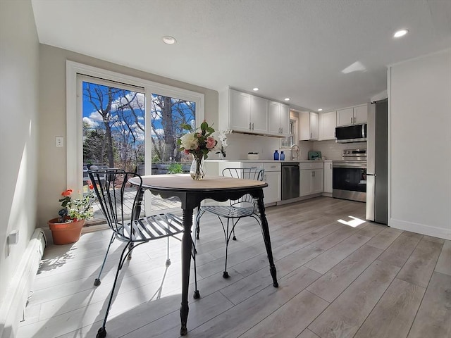11 Great Oak Rd, Brewster, MA 02631 - dining room with light wood-style floors and recessed lighting