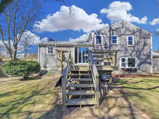 11 Great Oak Rd, Brewster, MA 02631 - rear view of house featuring a lawn, a chimney, stairway, and a deck