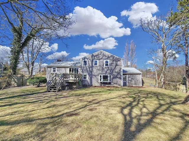 11 Great Oak Rd, Brewster, MA 02631 - back of property with a lawn, a wooden deck, and fence