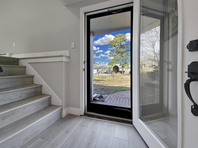 11 Great Oak Rd, Brewster, MA 02631 - foyer entrance featuring baseboards, light wood-type flooring, and stairway