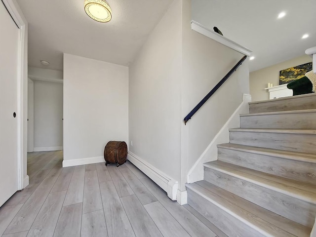11 Great Oak Rd, Brewster, MA 02631 - stairs featuring baseboards, wood finished floors, and a baseboard radiator