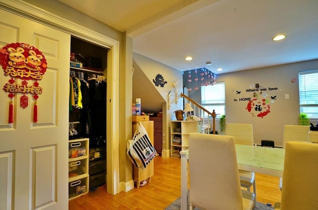 playroom featuring light wood-type flooring, a wealth of natural light, and recessed lighting