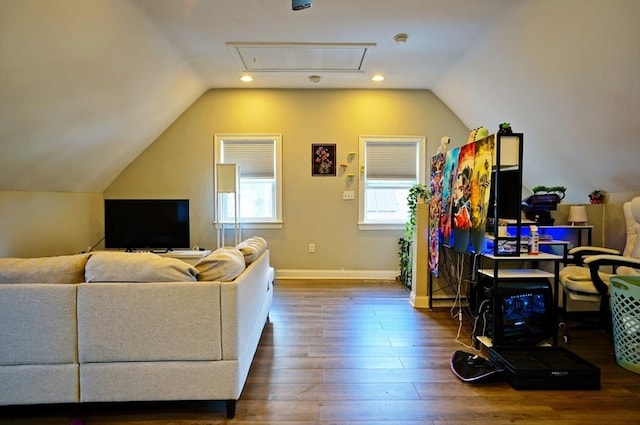 living area featuring lofted ceiling, recessed lighting, wood finished floors, and baseboards