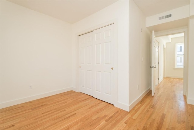 148-150 Pleasant St, Boston, MA 02125 - unfurnished bedroom featuring light wood finished floors and a closet
