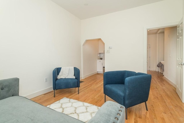 148-150 Pleasant St, Boston, MA 02125 - living area with light wood-type flooring and arched walkways