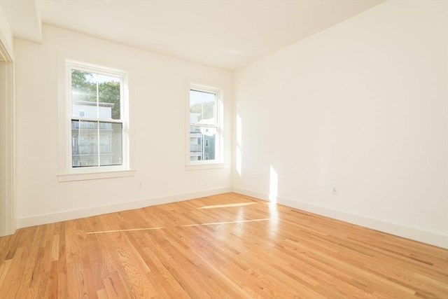 148-150 Pleasant St, Boston, MA 02125 - empty room with light wood-style floors and baseboards