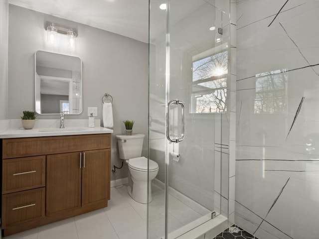 bathroom with vanity, toilet, and walk in shower