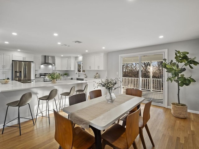 dining room featuring light hardwood / wood-style floors