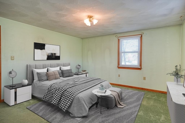 bedroom with carpet floors, a textured ceiling, and baseboards
