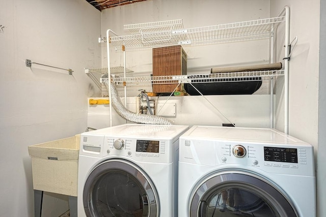washroom featuring laundry area and washer and dryer