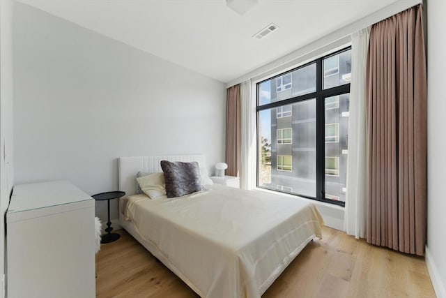 191 Washington St Unit 524, Boston, MA 02135 - bedroom with light wood-style flooring and baseboards