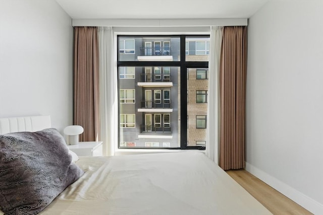 191 Washington St Unit 524, Boston, MA 02135 - bedroom featuring wood finished floors and baseboards