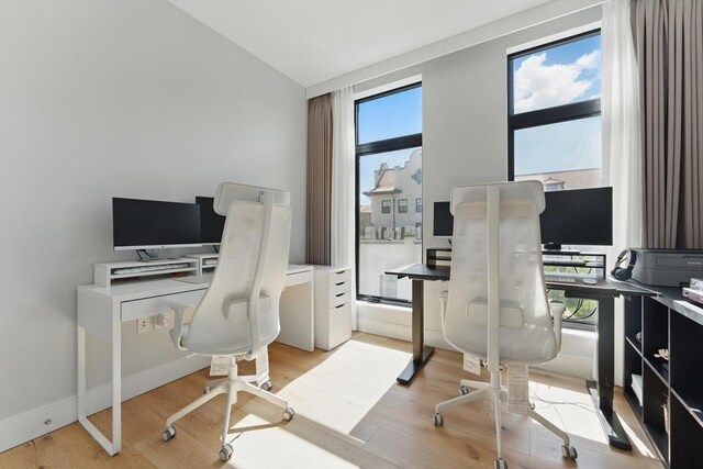 191 Washington St Unit 524, Boston, MA 02135 - home office with light wood finished floors and vaulted ceiling