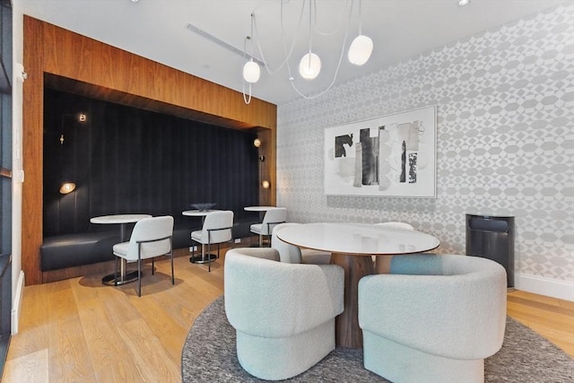 191 Washington St Unit 524, Boston, MA 02135 - dining area featuring wallpapered walls and wood finished floors