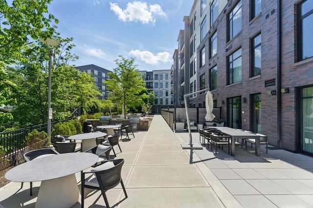 191 Washington St Unit 524, Boston, MA 02135 - view of home's community with outdoor dining space and a patio area