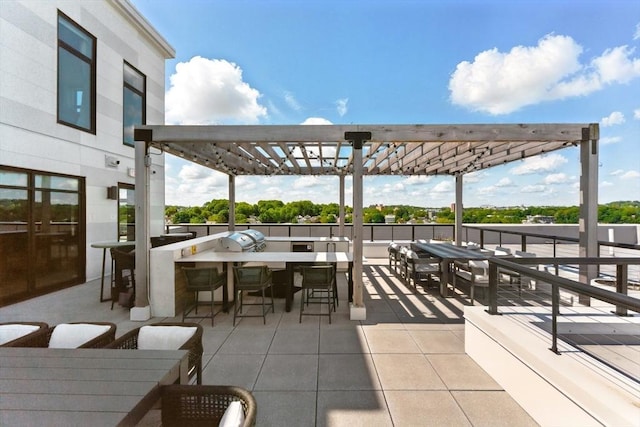 191 Washington St Unit 524, Boston, MA 02135 - view of patio featuring a pergola, area for grilling, and outdoor dining area