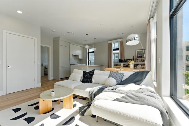 191 Washington St Unit 524, Boston, MA 02135 - living area with light wood-type flooring and recessed lighting