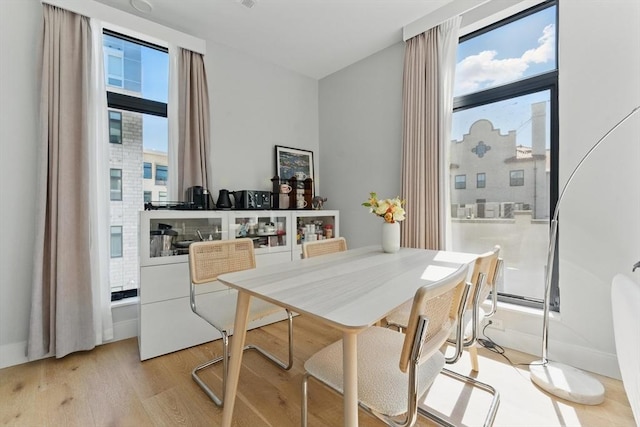 191 Washington St Unit 524, Boston, MA 02135 - dining room with light wood-style floors