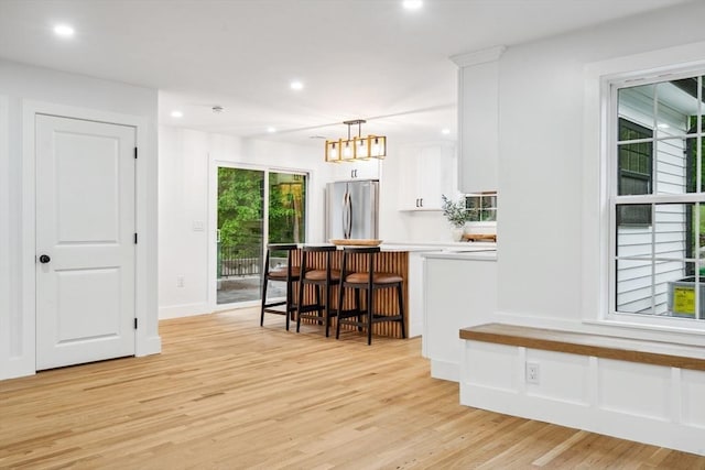 22 Longhill Rd, Ashland, MA 01721 - kitchen with freestanding refrigerator, white cabinets, light wood-type flooring, recessed lighting, and light countertops