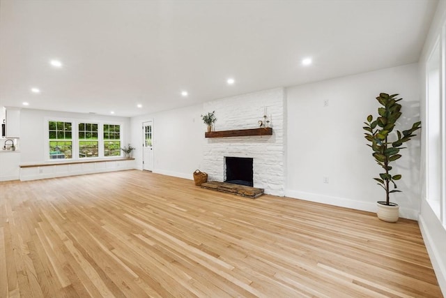 22 Longhill Rd, Ashland, MA 01721 - unfurnished living room featuring light wood-style flooring, recessed lighting, a fireplace, and baseboards