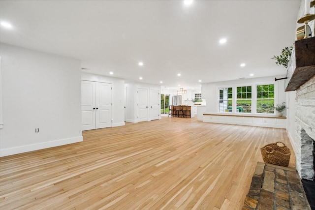 22 Longhill Rd, Ashland, MA 01721 - unfurnished living room with light wood-style floors, a fireplace, recessed lighting, and baseboards