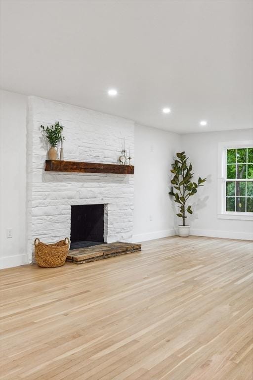22 Longhill Rd, Ashland, MA 01721 - unfurnished living room featuring baseboards, a stone fireplace, wood finished floors, and recessed lighting