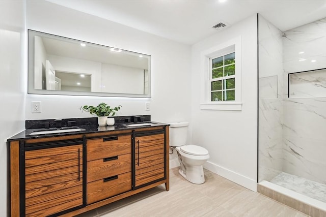 22 Longhill Rd, Ashland, MA 01721 - full bath featuring double vanity, toilet, a marble finish shower, and baseboards
