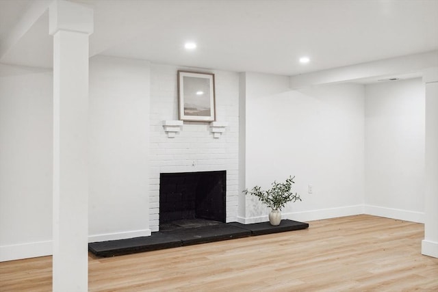 22 Longhill Rd, Ashland, MA 01721 - unfurnished living room featuring wood finished floors, recessed lighting, baseboards, and a brick fireplace