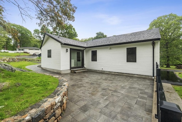 22 Longhill Rd, Ashland, MA 01721 - rear view of property featuring a patio area, a shingled roof, entry steps, and a yard