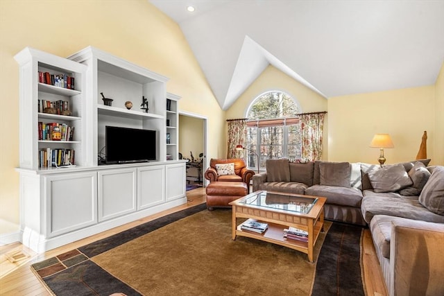 living area with dark wood-style floors and high vaulted ceiling