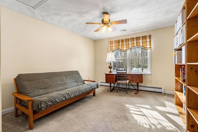 living area with a baseboard radiator, carpet flooring, visible vents, baseboards, and a ceiling fan