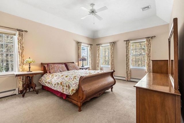 bedroom featuring a ceiling fan, light colored carpet, visible vents, and vaulted ceiling