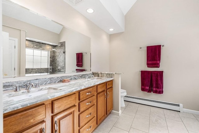 full bathroom featuring tiled shower, toilet, a baseboard radiator, vaulted ceiling, and a sink