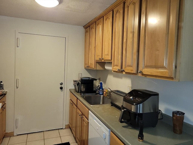 4 Post Oak Ln Unit 15, Natick, MA 01760 - kitchen featuring white dishwasher, light tile patterned floors, brown cabinetry, and a textured ceiling