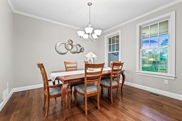 32 Rideout Rd, Hollis, NH 03049 - dining area featuring ornamental molding, a chandelier, and dark wood-type flooring