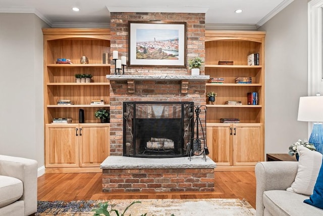 32 Rideout Rd, Hollis, NH 03049 - living area with light wood-style flooring, ornamental molding, a brick fireplace, and recessed lighting