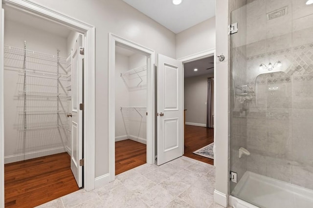 32 Rideout Rd, Hollis, NH 03049 - full bathroom with a shower stall, a walk in closet, wood finished floors, and recessed lighting