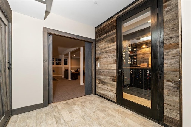 32 Rideout Rd, Hollis, NH 03049 - wine room with wood walls and light wood finished floors