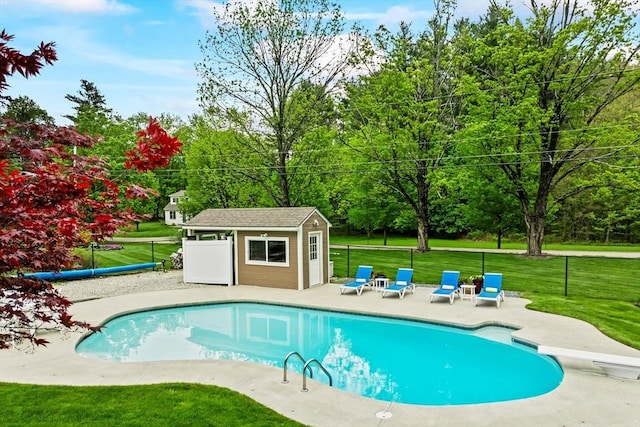 32 Rideout Rd, Hollis, NH 03049 - swimming pool with an outbuilding, a patio area, and a diving board