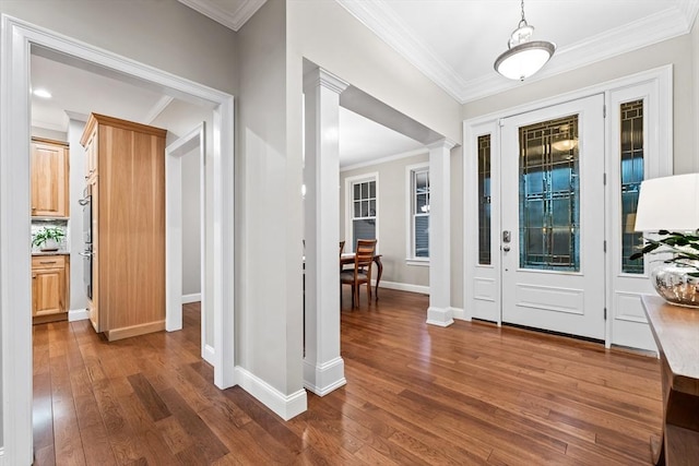 32 Rideout Rd, Hollis, NH 03049 - entrance foyer with dark wood-type flooring, ornamental molding, and ornate columns