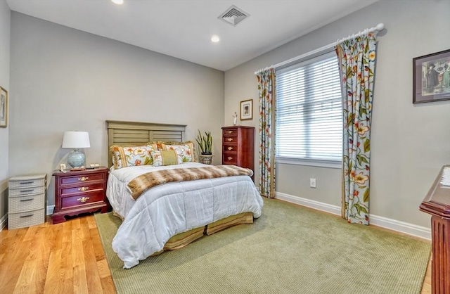 bedroom with baseboards, recessed lighting, and visible vents