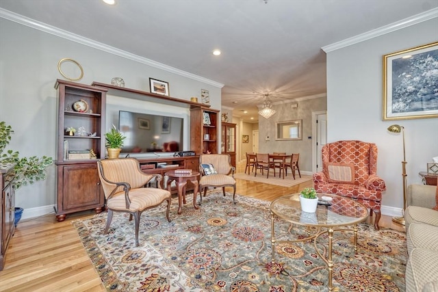 living area with light wood-style floors, baseboards, crown molding, and recessed lighting