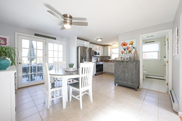 dining area featuring a baseboard radiator, baseboard heating, ceiling fan, and light tile patterned flooring