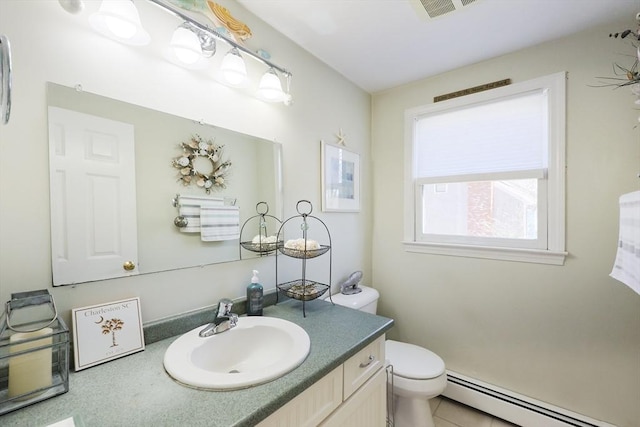 bathroom with a baseboard radiator, toilet, and vanity