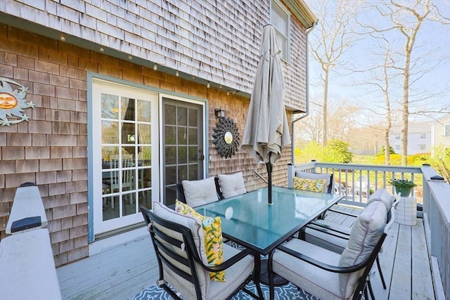 deck with outdoor dining area