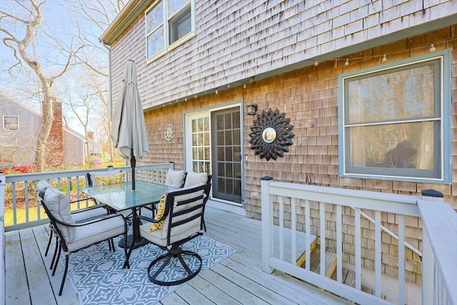 deck with outdoor dining area